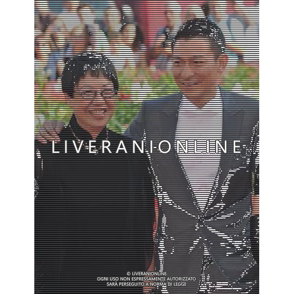 (110906) -- VENICE, Sept. 6, 2011 () -- Director Ann Hui (L) and actor Andy Lau pose on the red carpet for the premiere of the Chinese Hong Kong film \'Taojie (A Simple Life)\' at the 68th Venice International Film Festival in Venice, Italy, Sept. 5, 2011. (/Wang Qingqin) (djj)