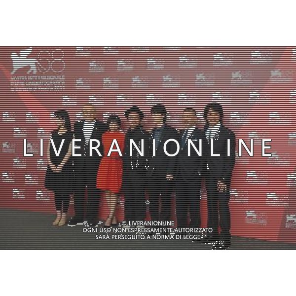 VENICE, Sept. 6, 2011 Japanese director Sion Sono (4th L) and cast members pose during the photo call for the film \'Himizu\' at the 68th Venice International Film Festival in Venice, Italy, Sept. 6, 2011. (/Wang Qingqin) (djj)