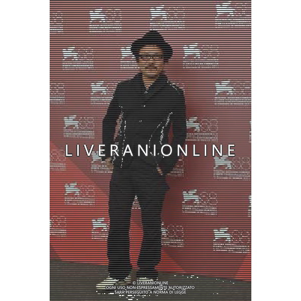 VENICE, Sept. 6, 2011 Japanese director Sion Sono poses during the photo call for his film \'Himizu\' at the 68th Venice International Film Festival in Venice, Italy, Sept. 6, 2011. (/Wang Qingqin) (djj)