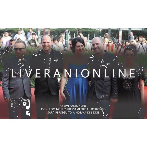 (110907) -- VENICE, Sept. 7, 2011 () -- Israeli director Eran Kolirin (2nd R) and cast members pose on the red carpet for the premiere of the film \'Hahithalfut (The exchange)\' at the 68th Venice International Film Festival in Venice, Italy, Sept. 7, 2011. (/Wang Qingqin) (zcc)