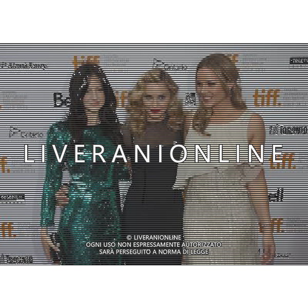 (110913) -- TORONTO, Sept. 13, 2011 () -- Actress Abbie Cornish (R), director Madonna and actress Andrea Riseborough pose before the screening of \'W.E.\' at Roy Thomson Hall during the 36th Toronto International Film Festival in Toronto, Canada, Sept.12, 2011. (/Zou Zheng)(msq)
