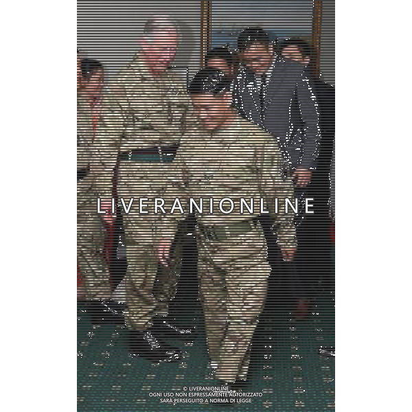 Corporal Harribahadar Budha, who lost his legs whilst on service in Afghanistan demonstrates his ability to walk to the Prince of Wales, during a visit to First Battalion The Royal Gurkha Rifles at Sir John Moore Barracks, in Folkestone, Kent. ©photoshot/AGENZIA ALDO LIVERANI SAS - ITALY ONLY - REALI INGLESI: Carlo d\'inghilterra, Principe di Galles, durante una visita al primo battaglione The Rifles Gurkha Reali della caserma Sir John Moore, in Folkestone nel Kent. 