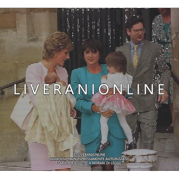 HRH PRINCESS OF WALES with Dominic Lawson and wife at the christening of their daughter - Date: 03.07.1995. Ref: B115_083601_1177. COMPULSORY CREDIT: Alan Davidson / Bandphoto / UPPA/Photoshot. PHOTOSHOT/ALDO LIVERANI SAS - ITALY ONLY -