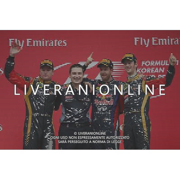1st place Sebastian Vettel (GER) Red Bull Racing, 2nd place Kimi Raikkonen (FIN) Lotus F1 Team and 3rd place Romain Grosjean (FRA) Lotus F1 E21. 06.10.2013. Formula 1 World Championship, Rd 14, Korean Grand Prix, Yeongam, South Korea, Race Day. - www.xpbimages.com, EMail: requests@xpbimages.com - copy of publication required for printed pictures. Every used picture is fee-liable. © Copyright: Batchelor / XPB Images /Ag. Aldo Liverani s.a.s.-Only Italy-Editorial Use Only