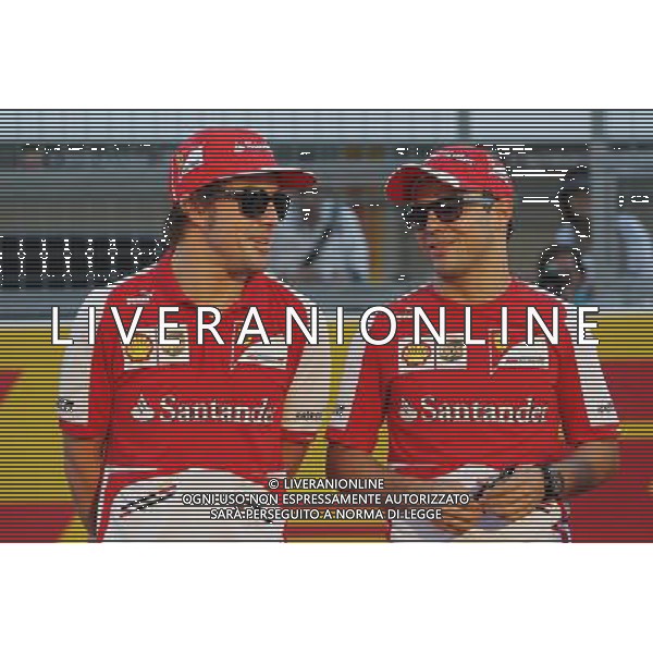 (L to R): Fernando Alonso (ESP) Ferrari with team mate Felipe Massa (BRA) Ferrari. 10.10.2013. Formula 1 World Championship, Rd 15, Japanese Grand Prix, Suzuka, Japan, Preparation Day. - www.xpbimages.com, EMail: requests@xpbimages.com - copy of publication required for printed pictures. Every used picture is fee-liable. © Copyright: Moy / XPB Images /AGENZIA ALDO LIVERANI SAS - ITALY ONLY - Gp f1 giappone 10 ottobre 2013