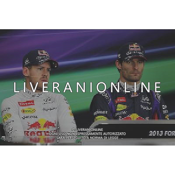 (L to R): Sebastian Vettel (GER) Red Bull Racing with team mate Mark Webber (AUS) Red Bull Racing in the FIA Press Conference. 12.10.2013. Formula 1 World Championship, Rd 15, Japanese Grand Prix, Suzuka, Japan, Qualifying Day. - www.xpbimages.com, EMail: requests@xpbimages.com - copy of publication required for printed pictures. Every used picture is fee-liable. © Copyright: Moy / XPB Images AG ALDO LIVERANI SAS ONLY ITALY
