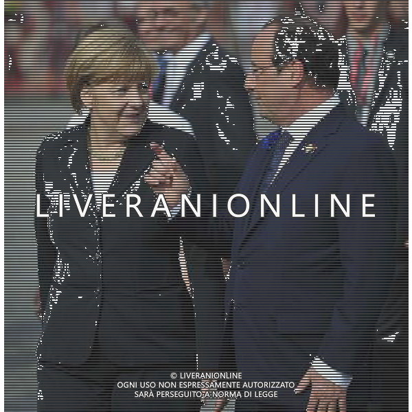 (140626) -- BRUSSELS, June 26, 2014 () -- German Chancellor Angela Merkel (L) talks with French President Francois Hollande after a ceremony marking the centenary of the outbreak of World War I, in Ypres, northwest of Belgium, on June 26, 2014. During the war, hundreds of thousands of soldiers and civilians from all over the world lost their lives around the Belgian town of Ypres. EU leaders begin a two-day summit here, one of the World War I\'s deadliest battlefields, on Thursday. (/Ye Pingfan) ©PHOTOHOT/Agenzia Aldo Liverani sas - ITALY ONLY - EDITORIAL USE ONLY