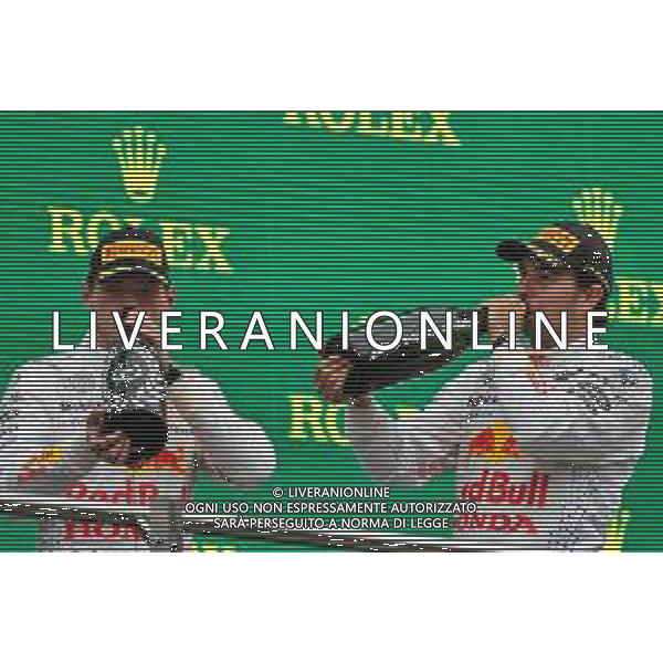 (L to R): Max Verstappen (NLD) Red Bull Racing celebrates his second position on the podium with third placed team mate Sergio Perez (MEX) Red Bull Racing. 10.10.2021. Formula 1 World Championship, Rd 16, Turkish Grand Prix, Istanbul, Turkey, Race Day. - www.xpbimages.com, EMail: requests@xpbimages.com © Copyright: Moy / XPB Images/AGENZIA ALDO LIVERANI SAS - ITALY ONLY EDITORIAL USE ONLY